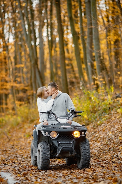 Young Caucasian Man Woman Riding Atv Quad Bike Autumn Forest Lovely Couple Kissing Couple Wearing Grey Sportive Costumes 1157 51385